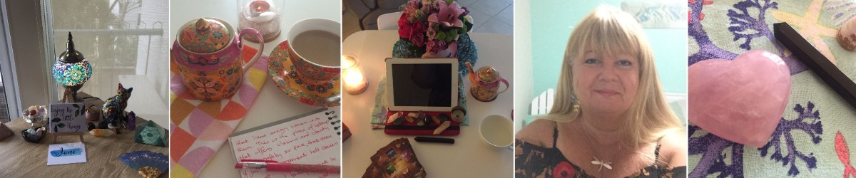 a table, a lamp and crystals next to a pot of tea, an ipad and tarot cards used by Jane Longstaff, clairvoyant reader